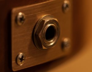 An output jack on an electric guitar