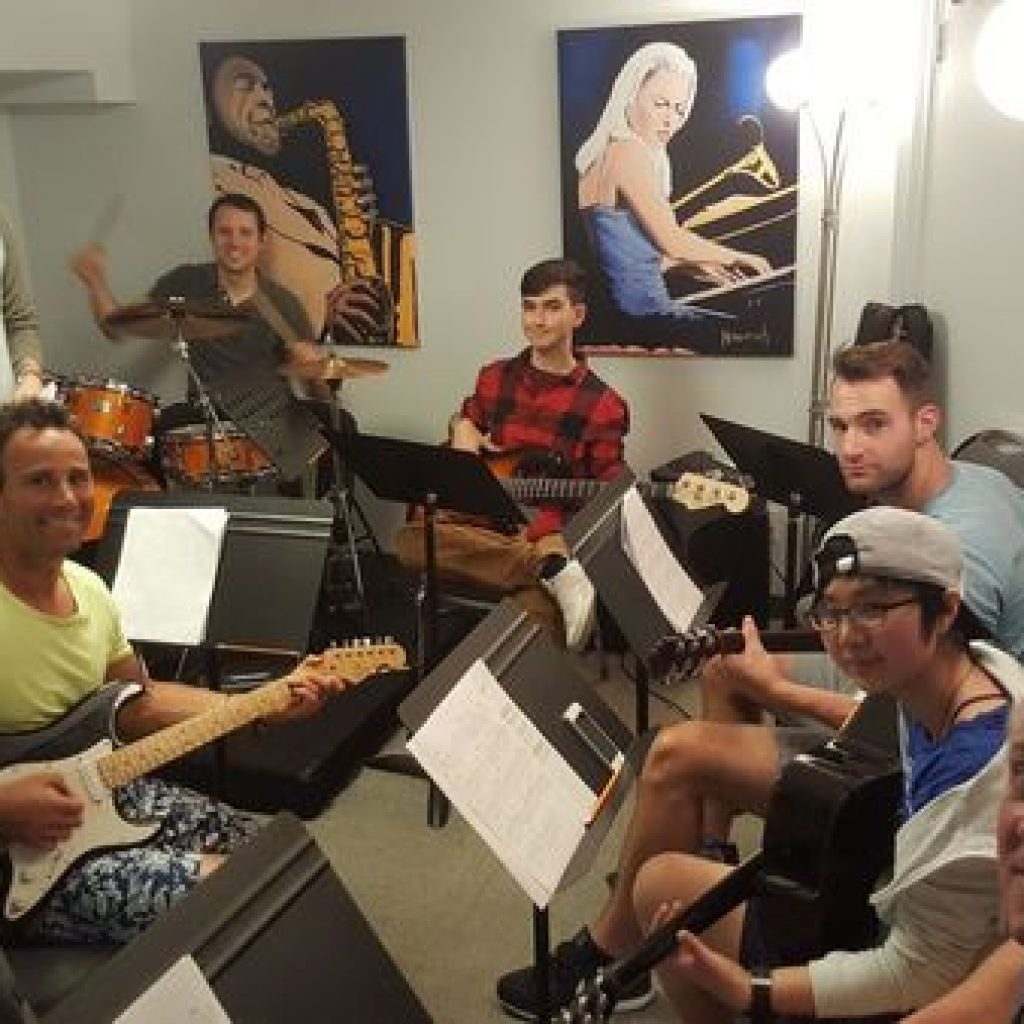 Students with their instruments in Music Theory Class at Toronto Guitar Class