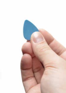 A standard size guitar pick