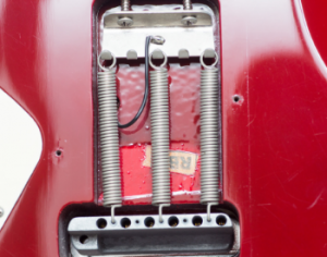 Back view of a wammy bar system for electric guitar