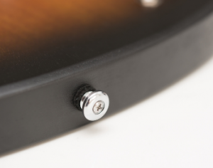 A strap button on an electric guitar