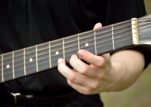 A guitar neck being played