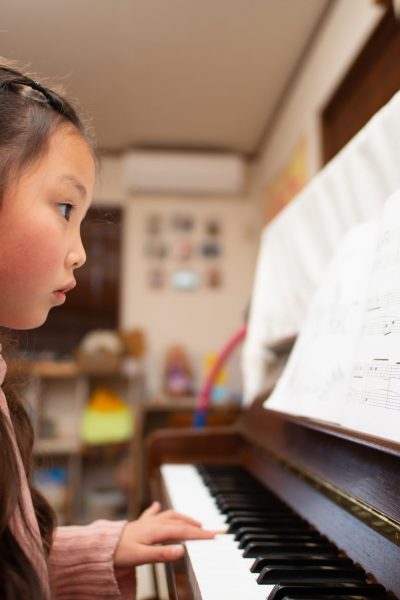 little girl practicing piano at Toronto Guitar School
