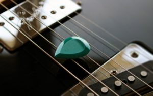 A thick pick with beveled edges